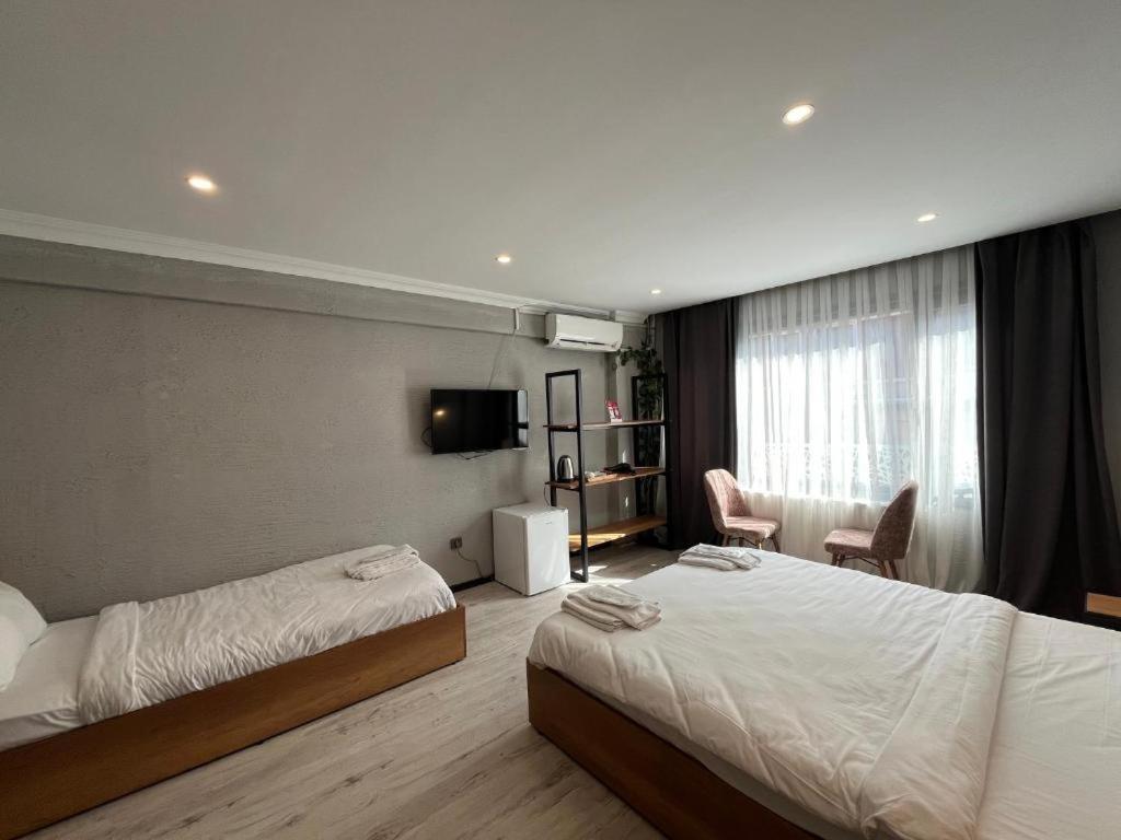 Deluxe Üç Kişilik Oda
